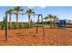 Playground with swings and play area at 8437 Skye Ranch Blvd, Sarasota, FL 34241