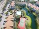 Aerial view of community pool and tennis court at 850 S Tamiami Trl # 724, Sarasota, FL 34236