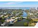 Wide aerial showcasing waterfront homes and lush greenery along the canal at 850 S Tamiami Trl # 724, Sarasota, FL 34236