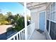 Private balcony with view of parking lot and trees at 850 S Tamiami Trl # 724, Sarasota, FL 34236