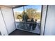 Private balcony offering screened-in views of lush landscaping at 850 S Tamiami Trl # 724, Sarasota, FL 34236