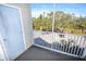 Screened balcony overlooking a parking lot and trees at 850 S Tamiami Trl # 724, Sarasota, FL 34236