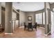 Dining room with a table for six, built in shelves and large picture window with shutters at 8727 Grey Oaks Ave, Sarasota, FL 34238