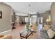 Comfortable living room with an open floor plan flowing to the dining room and foyer at 8727 Grey Oaks Ave, Sarasota, FL 34238