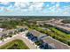 Aerial view of community showcasing ponds, landscaping, and multiple residences at 8737 Daydream St, Sarasota, FL 34238