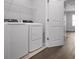 Laundry room featuring modern washer and dryer units, and wire shelving at 8737 Daydream St, Sarasota, FL 34238