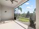 Screened patio offering views of manicured landscaping and tropical palm trees at 8737 Daydream St, Sarasota, FL 34238