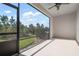 Screened patio overlooking a lush lawn and mature landscaping at 8737 Daydream St, Sarasota, FL 34238