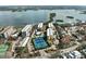 Aerial perspective of community near the water with tennis courts at 8767 Midnight Pass Rd # 505F, Sarasota, FL 34242