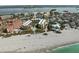 Aerial view of beachfront condo community with white sand beach at 8767 Midnight Pass Rd # 505F, Sarasota, FL 34242