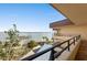 Balcony view overlooking the water with marina and beautiful landscape at 8767 Midnight Pass Rd # 505F, Sarasota, FL 34242