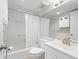 Bathroom with shower/tub, vanity, and white tile at 8767 Midnight Pass Rd # 505F, Sarasota, FL 34242