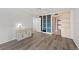 Bedroom with built-in shelving and hardwood floors at 8767 Midnight Pass Rd # 505F, Sarasota, FL 34242