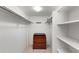 Large walk-in closet with shelving and dresser at 8767 Midnight Pass Rd # 505F, Sarasota, FL 34242