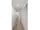 Bright hallway with wood-look floors and built-in storage at 8767 Midnight Pass Rd # 505F, Sarasota, FL 34242