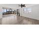 Bright living room with hardwood floors, fireplace, and water views at 8767 Midnight Pass Rd # 505F, Sarasota, FL 34242