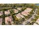 Aerial view of a lovely neighborhood with lakes and mature landscaping at 8849 Etera Dr, Sarasota, FL 34238