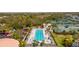 Overhead view of community lap pool with palm trees, lounge chairs and parking at 8849 Etera Dr, Sarasota, FL 34238