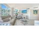 Cozy living room with bright windows offering city views with beach decor at 888 Blvd Of The Arts # 1608, Sarasota, FL 34236