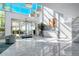 Bright and airy lobby with a reception desk, featuring marble floors and floor-to-ceiling windows at 888 Blvd Of The Arts # 1608, Sarasota, FL 34236