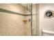 A bathroom shower with glass door and tile design at 888 Blvd Of The Arts # 1608, Sarasota, FL 34236