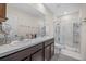 Double vanity bathroom with large walk-in shower at 8995 Milestone Dr, Sarasota, FL 34238