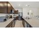 Modern kitchen with dark brown cabinets and granite countertops at 8995 Milestone Dr, Sarasota, FL 34238