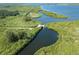 Panoramic aerial view of Charlotte Harbor, waterways, and lush landscapes surrounding South Gulf Cove at 9464 St Marys Ct, Port Charlotte, FL 33981