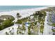 High angle view showcases beachside amenities surrounded by palm trees and manicured landscaping at 951 Contento St., Siesta Key, FL 34242