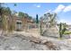 Backyard featuring a wood deck, a partial view of the home, white gravel and access to the canal at 951 Contento St., Siesta Key, FL 34242