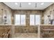 Bathroom featuring dual shower heads in walk-in shower with tile floors and walls at 951 Contento St., Siesta Key, FL 34242