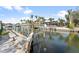 Picturesque waterfront canal with docks and lifts and beautiful homes in the background at 951 Contento St., Siesta Key, FL 34242