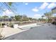 View of a spacious backyard pool with a wooden deck and canal access, perfect for relaxation and enjoying outdoor activities at 951 Contento St., Siesta Key, FL 34242