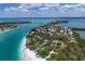 Aerial view of waterfront homes and lush tropical landscape at 1067 Westway Dr, Sarasota, FL 34236