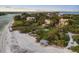 Luxury beachfront homes with lush tropical landscaping at 1067 Westway Dr, Sarasota, FL 34236