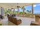 Expansive balcony with ocean views, seating, and ceiling fans at 1067 Westway Dr, Sarasota, FL 34236