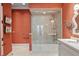 Spa-like bathroom with a large shower and soaking tub, featuring coral wallpaper at 1067 Westway Dr, Sarasota, FL 34236