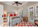 Bedroom with a metal bed frame and orange and white decor at 1067 Westway Dr, Sarasota, FL 34236