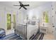 Bedroom with a metal bed frame and access to a private balcony at 1067 Westway Dr, Sarasota, FL 34236