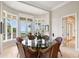 Ocean view breakfast room with glass-top table and wicker chairs at 1067 Westway Dr, Sarasota, FL 34236