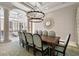 Formal dining room with large chandelier and seating for twelve at 1067 Westway Dr, Sarasota, FL 34236