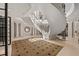 Grand entryway with a sweeping staircase and marble flooring at 1067 Westway Dr, Sarasota, FL 34236