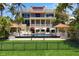 Stunning three-story home with pool and lush landscaping at 1067 Westway Dr, Sarasota, FL 34236
