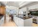 Bright kitchen, island, stainless steel appliances, and breakfast nook at 1067 Westway Dr, Sarasota, FL 34236