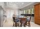 White kitchen with granite counters, island, and breakfast bar at 1067 Westway Dr, Sarasota, FL 34236