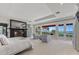 Spacious main bedroom with ocean views, fireplace, and sitting area at 1067 Westway Dr, Sarasota, FL 34236