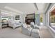 Large bedroom with ocean views, fireplace, and sitting area at 1067 Westway Dr, Sarasota, FL 34236