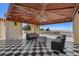Covered patio with ocean views, checkered floor, and comfortable seating at 1067 Westway Dr, Sarasota, FL 34236