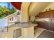 Outdoor kitchen with granite countertops and stainless steel appliances at 1067 Westway Dr, Sarasota, FL 34236