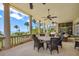 Outdoor patio with dining area and stunning ocean views at 1067 Westway Dr, Sarasota, FL 34236